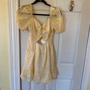 yellow puff sleeve cut out dress from ruby and jenna